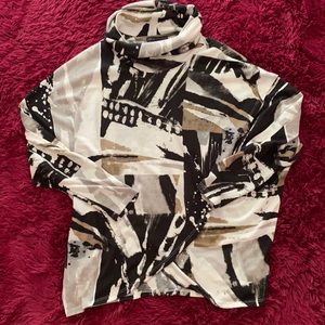 Black, tan, and grey poncho